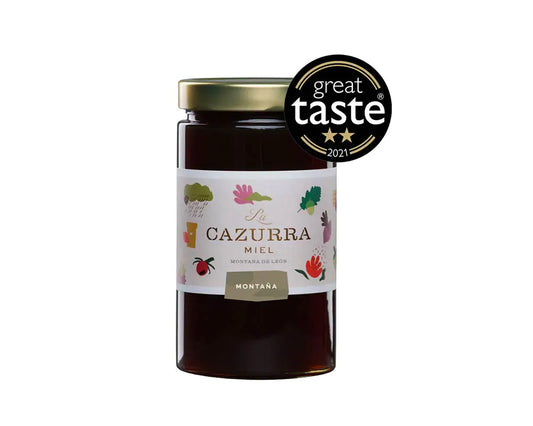 Se muestra un bote de miel con la etiqueta del premio recibido.