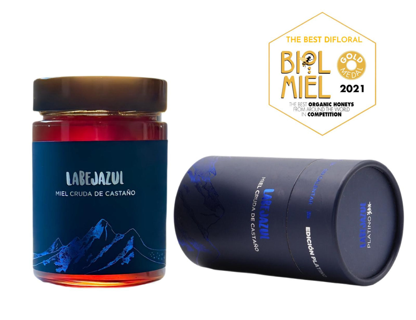 Se muestra un bote de miel artesanal y ecológica premium, con un bonito packaging azul. También se muestra una etiqueta del premio recibido en con la medalla de ORO.